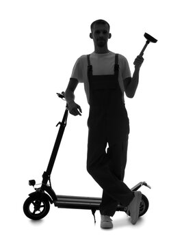 recommend clip art: Silhouette of male plumber with plunger and electric scooter on white background