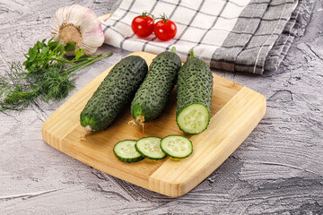 Raw green cucumbers with slices