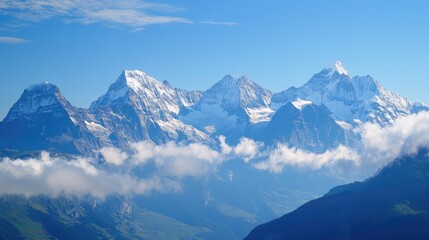 Fototapeta premium Majestic Snow-Capped Mountain Range with Clouds in the Foreground