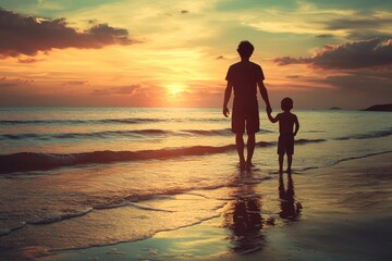 Silhouettes of father and son on beach. Illustrates a strong bond between parent and child.