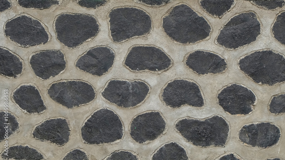 Aufkleber abstract shapes, patterns and textures of black stone walls arranged neatly. the shape of a round st