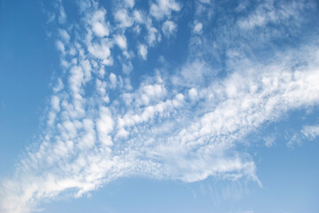 gentle white clouds in the blue sky