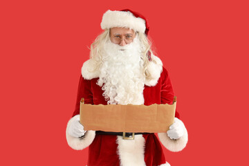Santa Claus with letter on red background
