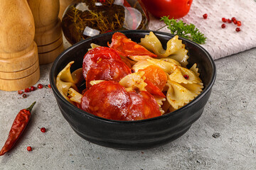 Italian pasta farfalle with pepperoni