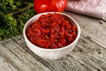 Diced ripe tomato with sauce