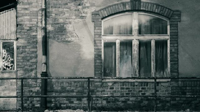 Horrible female ghost at the old grunge window 
