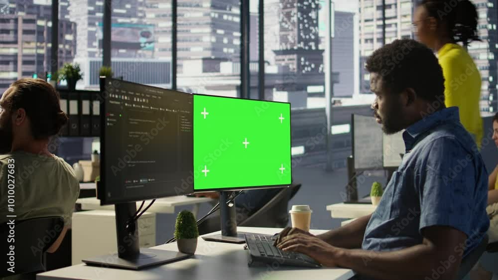Aufkleber programmer utilizing green screen computer to train machine learning models, zoom in shot. close up 