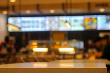 fast food restaurant cashier. blurry or defocused background.