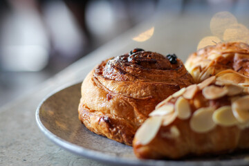 various breads for breakfast on an artistic plate.
