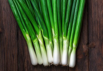 Obraz premium Fresh green onions on wooden background