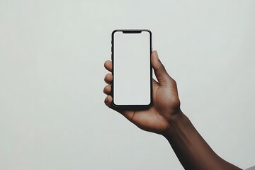 Fototapeta premium African man holding mobile phone horizontally for mockup design.