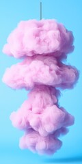 Fototapeta premium Abstract Pink Ink Cloud Hanging on a Blue Background