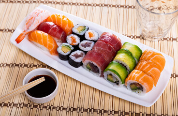 Appetizing set of various sushi rolls and nigiri with salmon, tuna, avocado and shrimp...