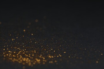 Beautiful shiny golden glitter on black background, closeup