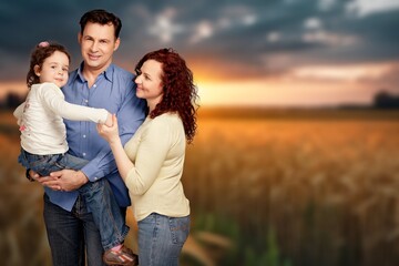 Fototapeta premium happy family walks with children in summer field