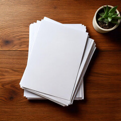 A stack of letter-sized white paper on an empty wooden desk, Top view