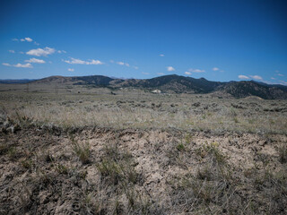 View of dry hillsides from Pipestone Montana in summer