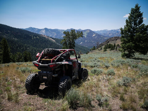 UTV parked on mountain top in Sawtooth national forest overlooking view in summer