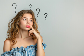 Thoughtful Young Woman in a Blue Dress Pondering with Question Marks Above