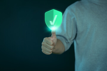 Person showing a glowing shield with a checkmark icon, symbolizing security, protection, and trust....