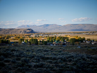 Obraz premium Rural farms and homes in Gunnison Colorado in fall with mountain backdrop