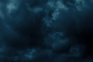 Obraz premium Dramatic stormy sky. Thunderstorm scary cloud in rainy season. Carbon dioxide, pollution, PM 2.5 and Halloween concepts. Dark blue green background. Nature backdrop.