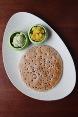 Ragi Set Dosa, Songy soft pancake, , dosa made with fermented batter of finger millet, rice and lentils, south Indian food served with coconut chutney and pototo curry (aloo masala)