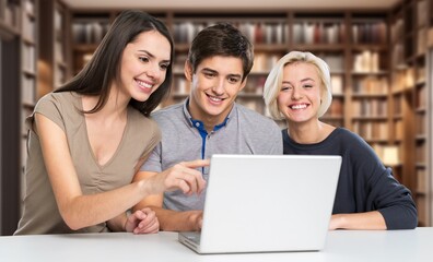 Group of students study materials in school library