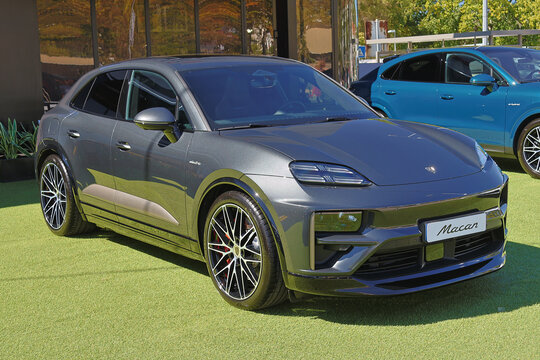 Porsche macan parked on grass at dealership