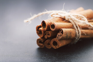 Cinnamon sticks on black background