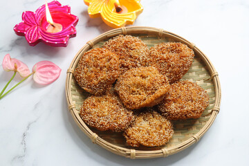 Anarsa is a popular Indian sweet made from rice, sugar, ghee, and poppy seeds. Traditionally part of Diwali Faral, Anarase is a crisp, rice based pastry enjoyed during the festive season. copy space.