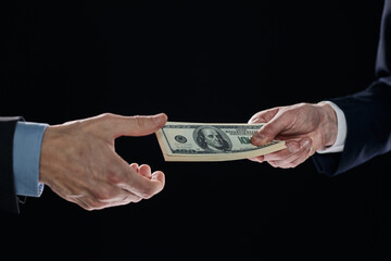 exchange of money cards between businessmen, close-up