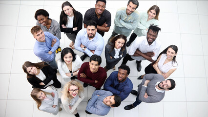large group of diverse young people looking up hopefully