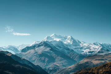 Fototapeta premium The mountains are covered in snow and the sky is clear and blue
