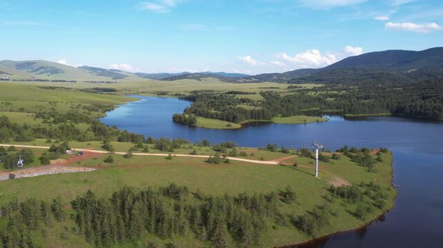 Aerial View of Zlatibor Mountain Serbia. Gondola Lift Above Lake and Green Landscape