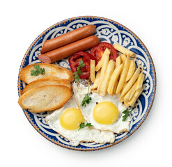 Breakfast plate with fried eggs, sausage, tomatoes, and fries served on a decorative blue plate