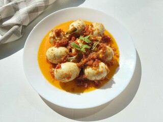 Egg Balado. Balado is a type of hot and spicy bumbu (spice mixture) found in Indonesian cuisine. Balado sauce is made by stir frying ground red hot chili pepper with other spices