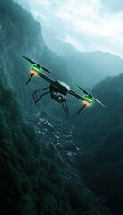 Fototapeta premium Drone flying over a lush green valley with misty mountains in the background.