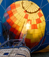 Fototapeta premium A hot air balloon with a fire in the bottom of it