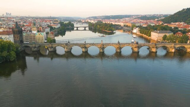 Aerial summer sunset view of the cityscape of Prague with Charles Bridge, Castle and old Lesser Town, Czech Republic