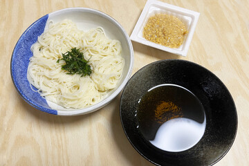 Boiled japanese somen noodles with japanese soup stock and natto