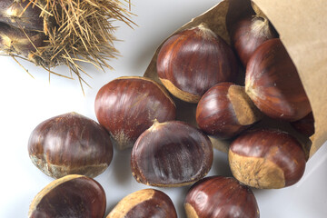 Chestnuts package isolated on white background. Autumn fruits concept