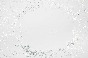 sparkles silver stars on white background with text place- Image
