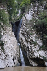 A beautiful waterfall in the Agura gorge. Recreation and travel.