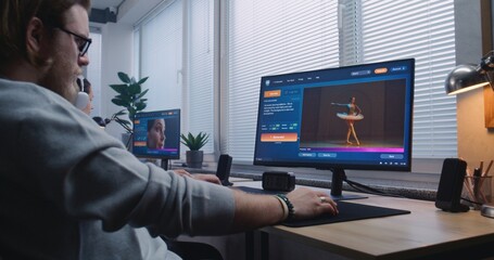 Adult man enters prompt in AI video generator on computer. Artificial intelligence chatbot app...