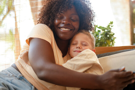 Multiracial family moment with African American mother and Caucasian son