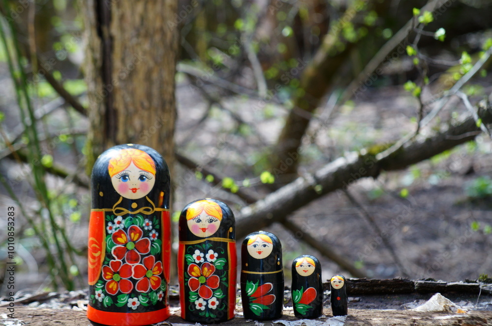 Wall mural A group of beautiful wooden dolls. Painted Slavic toys.