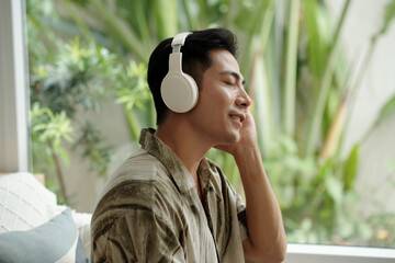 Man enjoying music in his headphones outdoors
