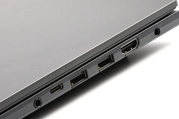 Detailed side view of modern laptop with Power ports, HDMI, USB and audio ports.