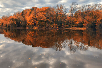 Autumn lake on dark background.